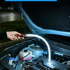 A hand holds a flexible silicone LED strip light inside a car engine bay.