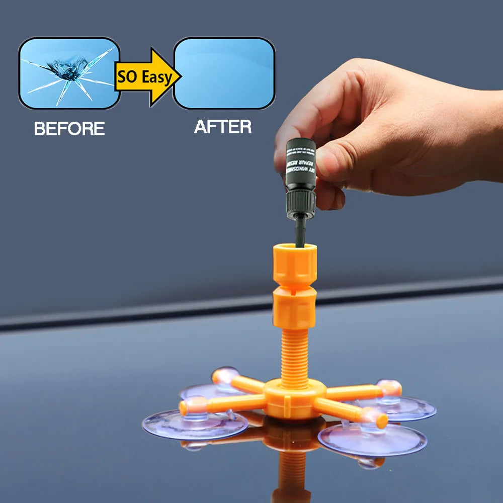 Eine Hand hält eine Spritze mit orangefarbener Kunststoffapplikator, die einfache Reparatur von Rissglass demonstriert.