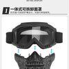 A black protective mask and goggles for outdoor activities, shown in a top-down view.