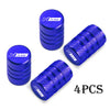 A set of four blue N Line CNC aluminum tire valve caps for car wheels.