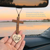 A handcrafted wooden cross hanging cord and tag for faith reminder use in cars or rooms.