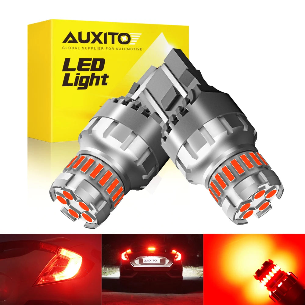 A pair of bright LED light bulbs for automotive brake lights shown next to a yellow box labeled AUXITO LED Light.
