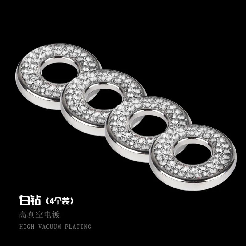 A row of circular, silver-toned rhinestone door lock decorations.