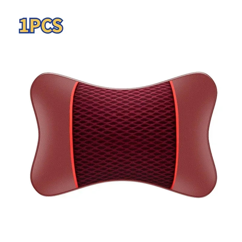 A single maroon ergonomic leather headrest and neck support cushion.