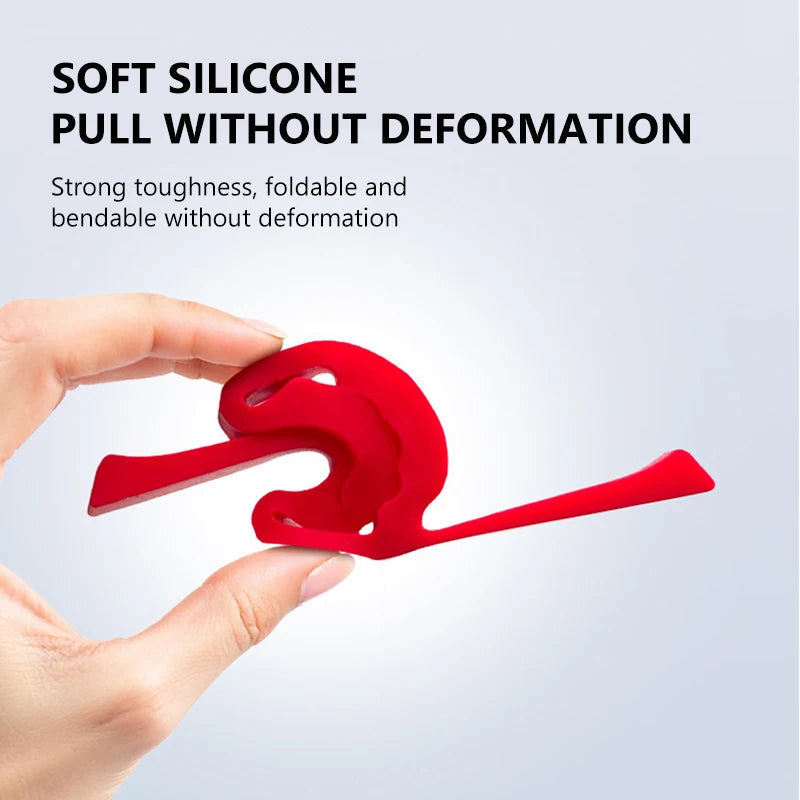 A hand holds a red silicone door lock protection pad, demonstrating its flexibility and durability.