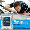 A man is using a blue clay bar on a car surface for auto detailing.