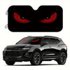 A black SUV with a foldable windshield sun shade installed, featuring a close-up of red eyes.