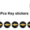 Five aluminum Chevrolet key emblem stickers displayed in a row.