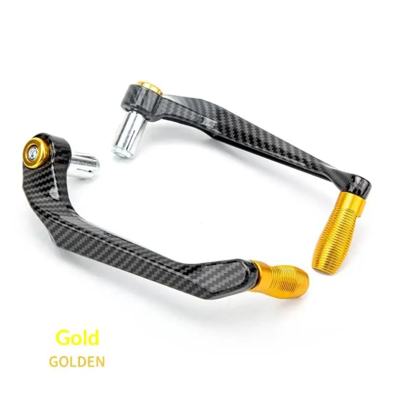 A motorcycle hand guard and lever protector made of black carbon fiber with gold accents.