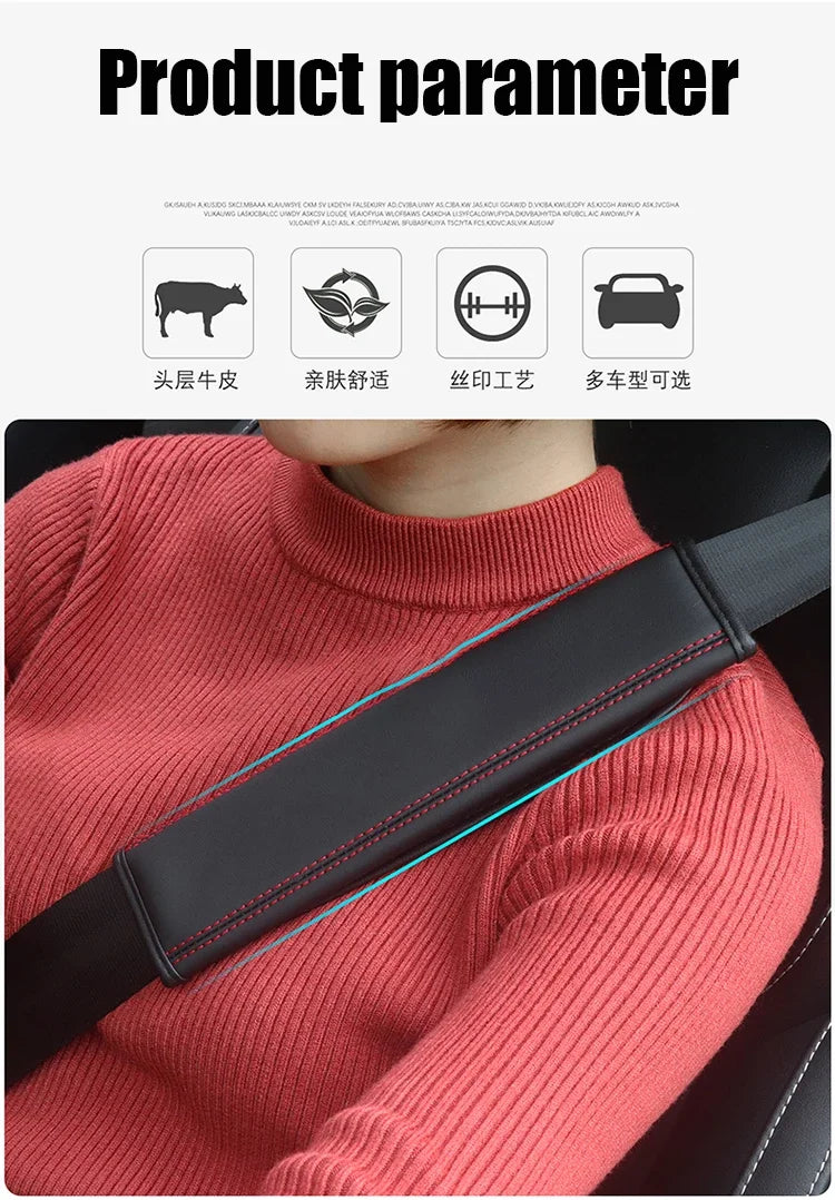 A close-up of a person wearing a red sweater with a black seat belt protector cover visible on their shoulder.