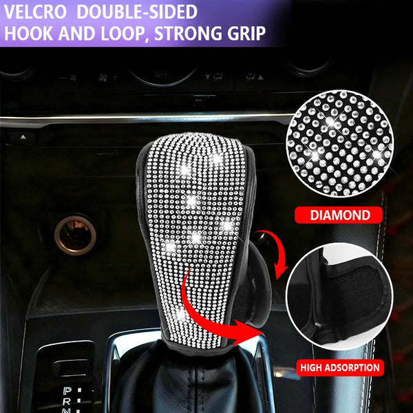 Close-up of a rhinestone gear shift knob cover with a velcro hook and loop grip on a car interior.