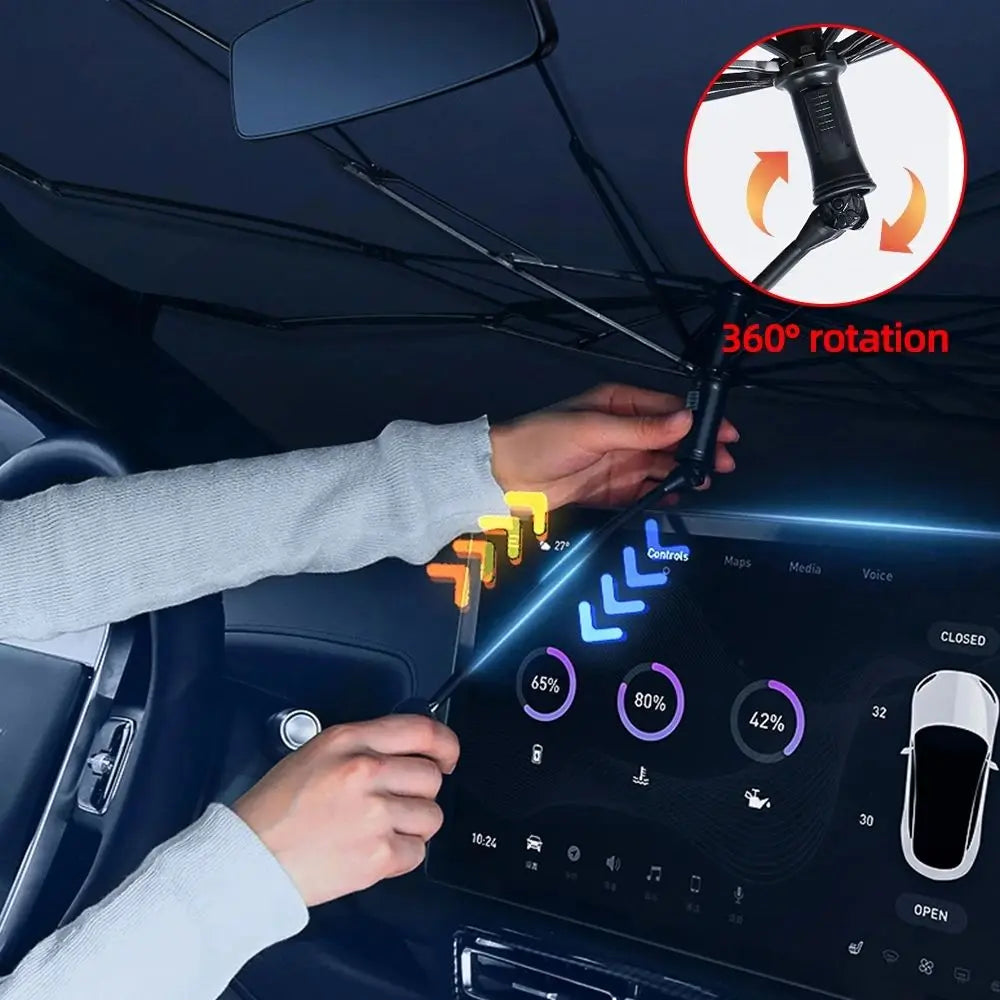 Hands are demonstrating the 360 degree rotation of a foldable car windshield sun shade with a bendable handle.