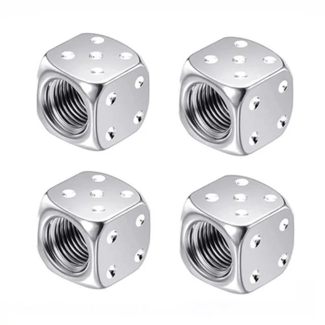 A set of four hexagonal aluminum alloy tire valve caps with visible threads.