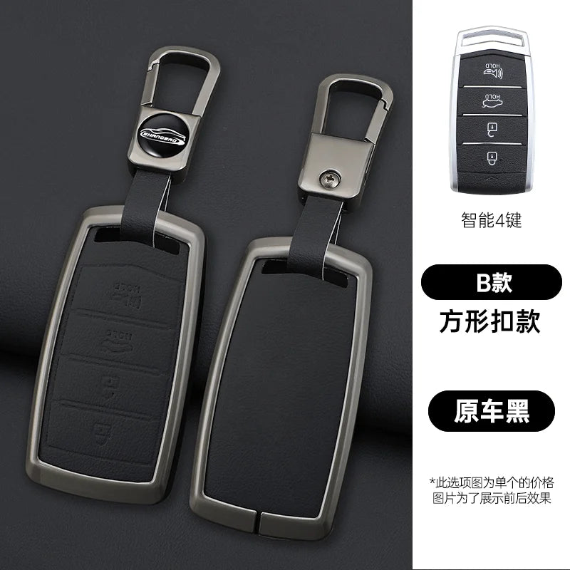 A pair of black zinc alloy car key cases with silver clasps and a keypad, shown against a dark background.