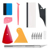 A kit of professional automotive film installation tools including various blades, a pink tool, and a silver knife.