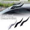Black dragon horn car roof decoration installed on a vehicle.