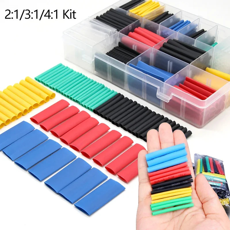 A kit of heat shrink tubing in various colors including yellow, red, blue, and green, packaged in a clear plastic box.