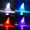 Four views of a solar car antenna shark fin roof light illuminating different colors.