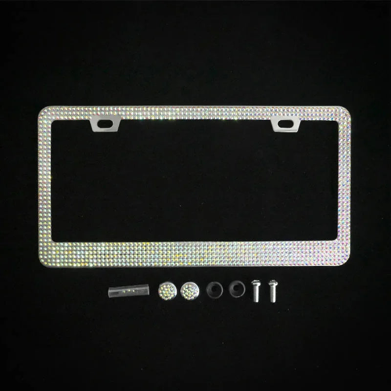 A rectangular license plate frame decorated with sparkling crystal rhinestones and mounting tabs.