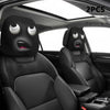 Two black car seat headrest covers with a decorative pattern shown inside a car interior.