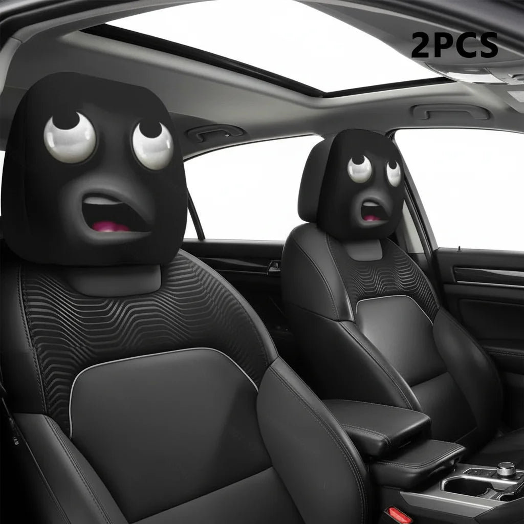 Two black car seat headrest covers with a decorative pattern shown inside a car interior.