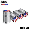 Set of four silver aluminum tire valve caps featuring the American flag design in red, white, and blue.