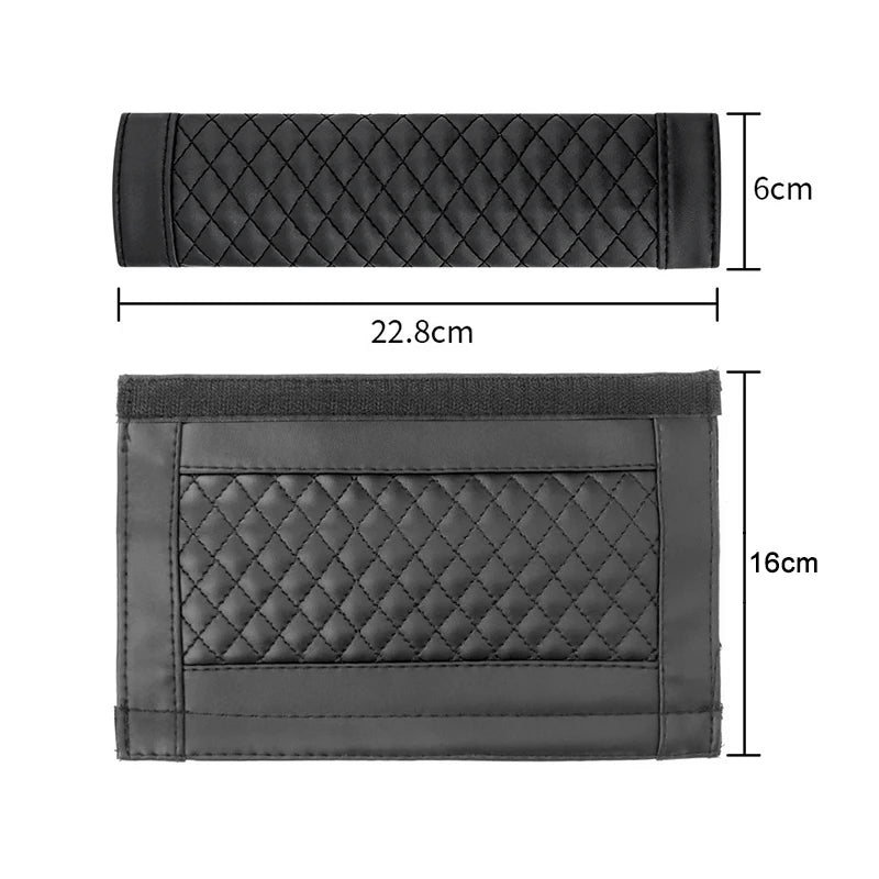 A pair of black PU leather car seat belt covers, shown flat and folded.