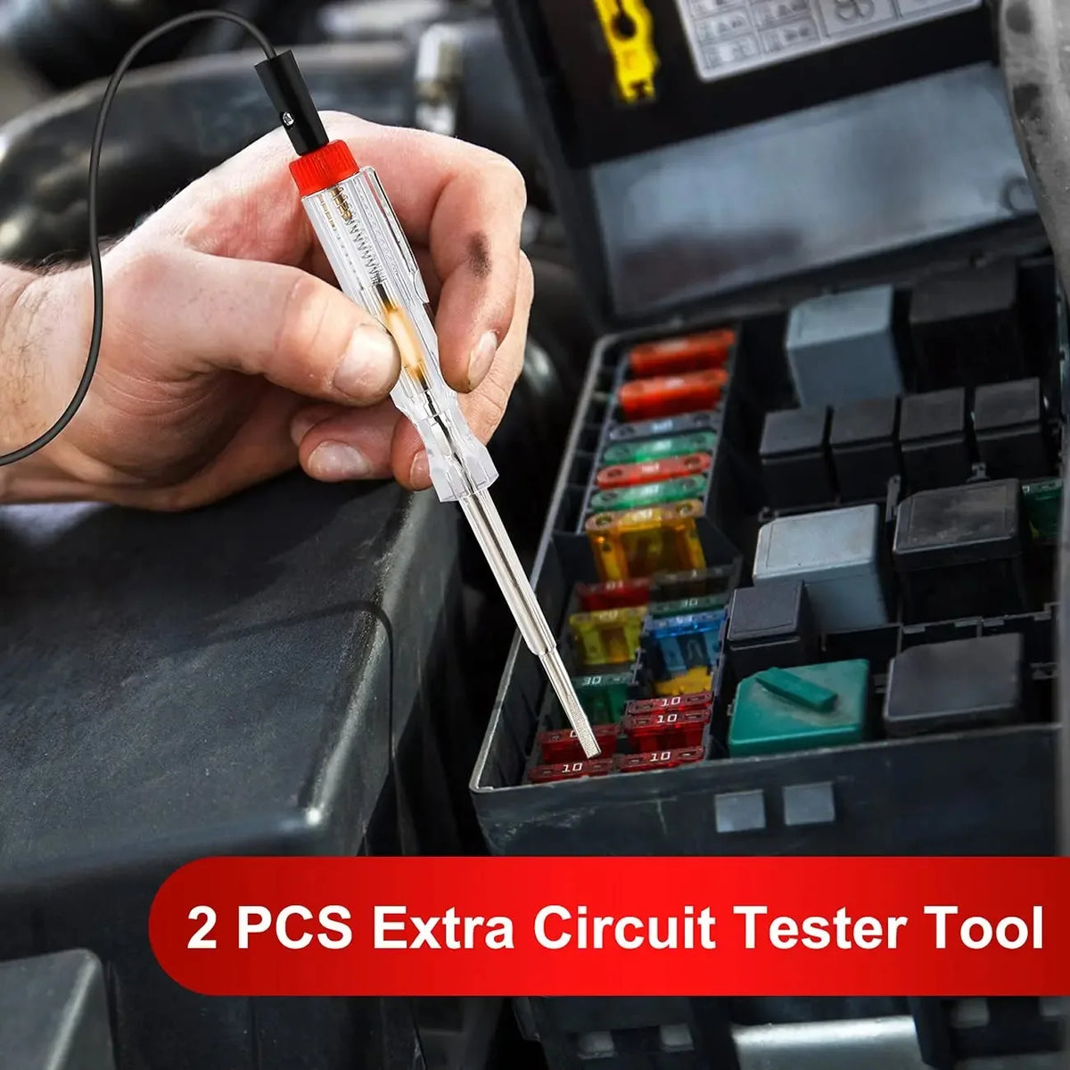 A hand is using a pin tool to test circuits inside a black car fuse kit box.