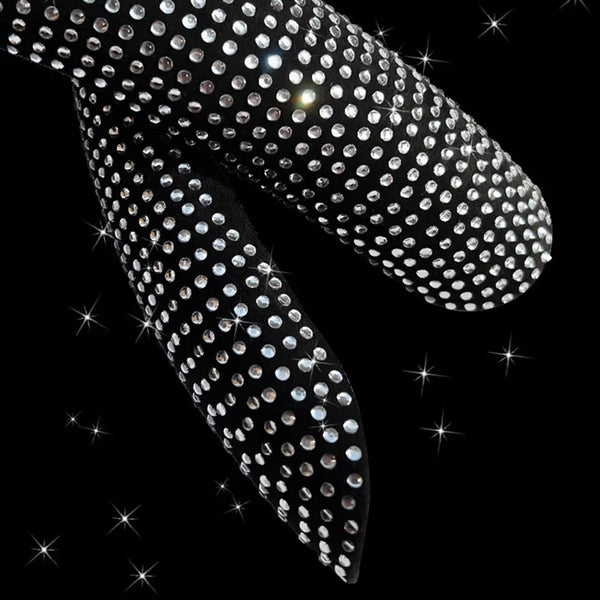 Close-up of a black steering wheel cover heavily encrusted with clear diamonds.