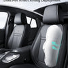 A close-up view of a black car seat with white protective padding, emphasizing safety features.