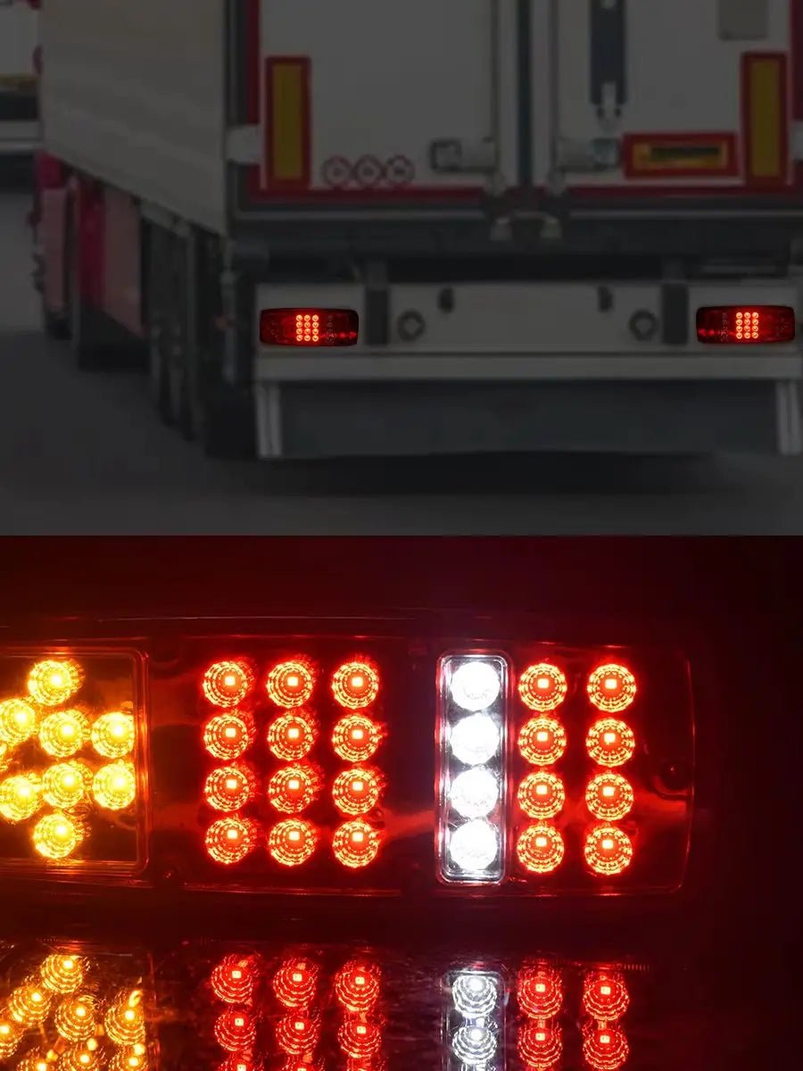Close-up view of dual high-brightness red tail lights on a commercial truck.