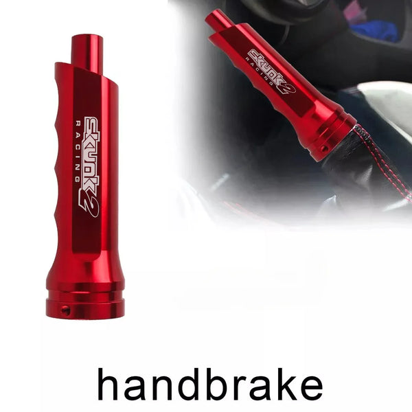A red aluminum handbrake cover for a manual transmission, shown in detail and mounted on a vehicle.