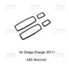 A set of black carbon fiber interior decoration trim pieces for a Dodge Charger.