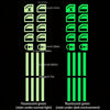A vertical display of fluorescent green buttons and indicators for a car window, showing both normal light and dark environme