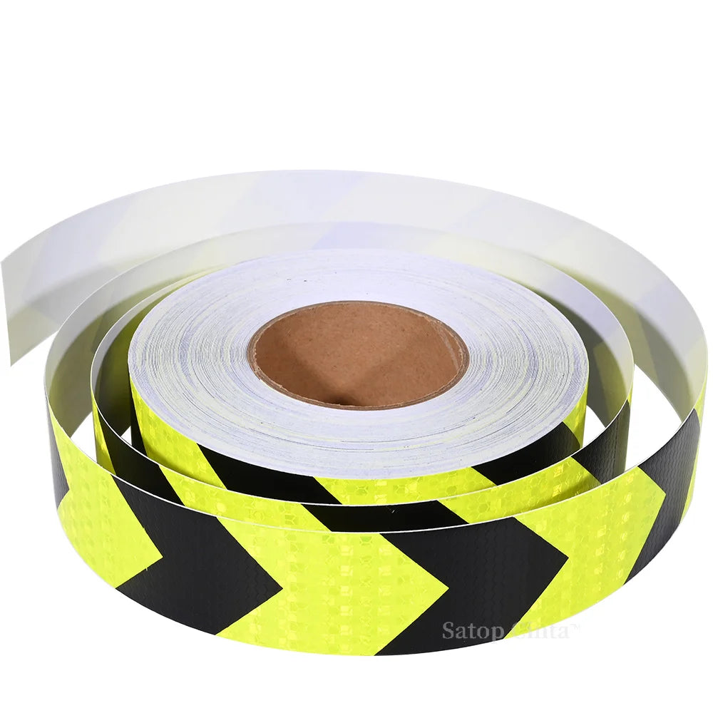 Roll of high-visibility fluorescent yellow and black reflective safety tape