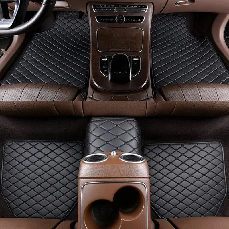 Interior view of a car with brown leather floor mats and wood-trimmed center console.