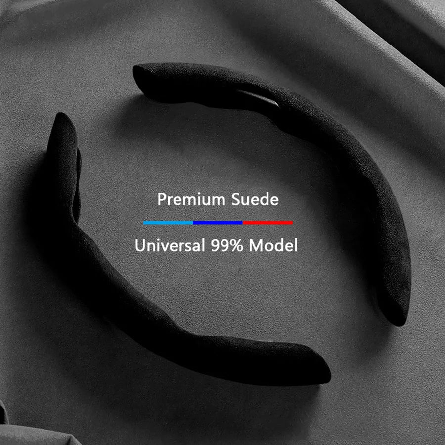 Black suede steering wheel cover for a car, shown in a close-up view.