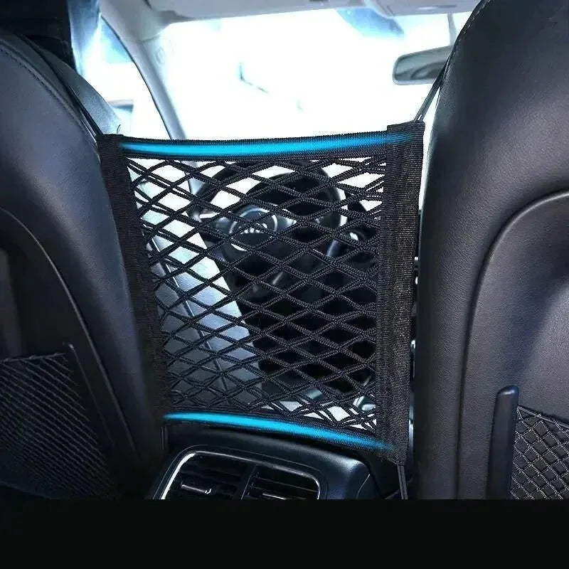 A close-up view of a black high-stretch double-layer motorcycle cargo net with blue accents installed in a car interior.