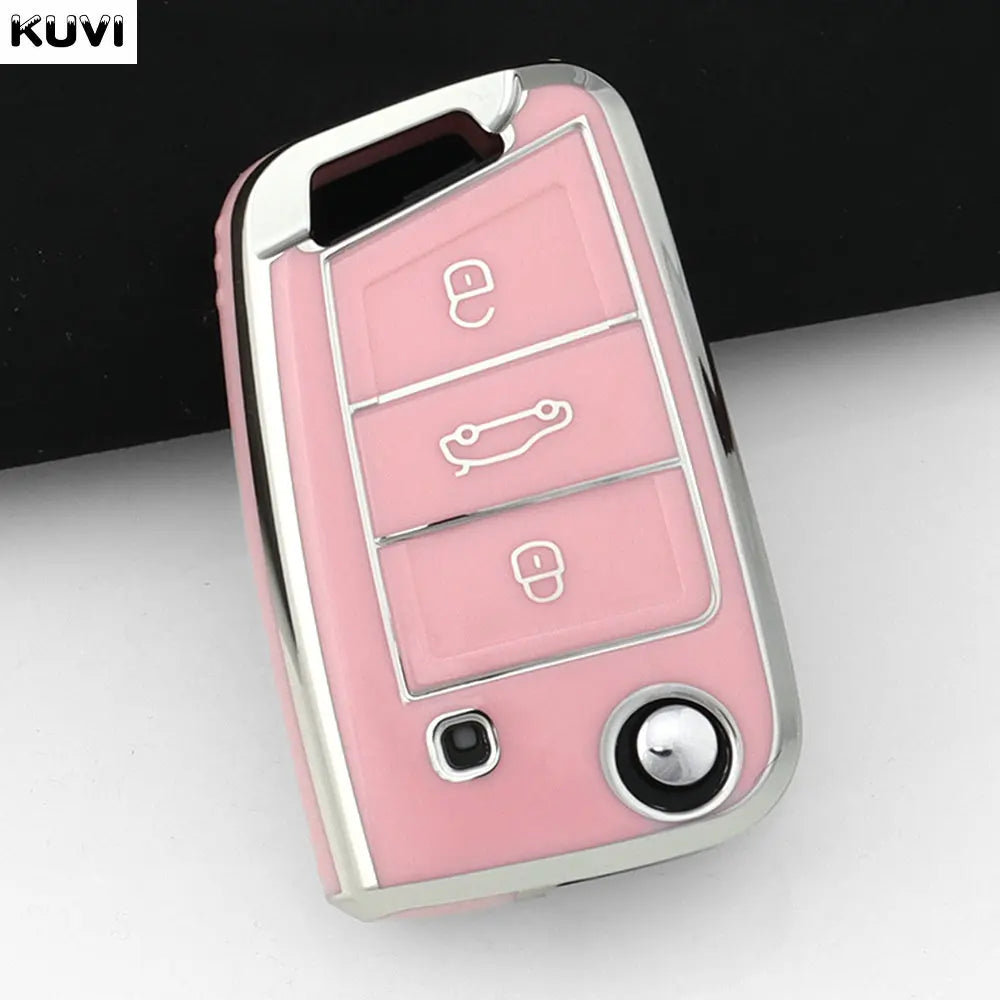 Pinkes TPU Auto-Schlüsselcover mit mehreren Ausschnitten und einer runden Taste vor dunklem Hintergrund.