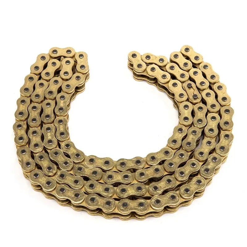A curved heavy-duty motorcycle chain made of brass or gold-toned metal links.