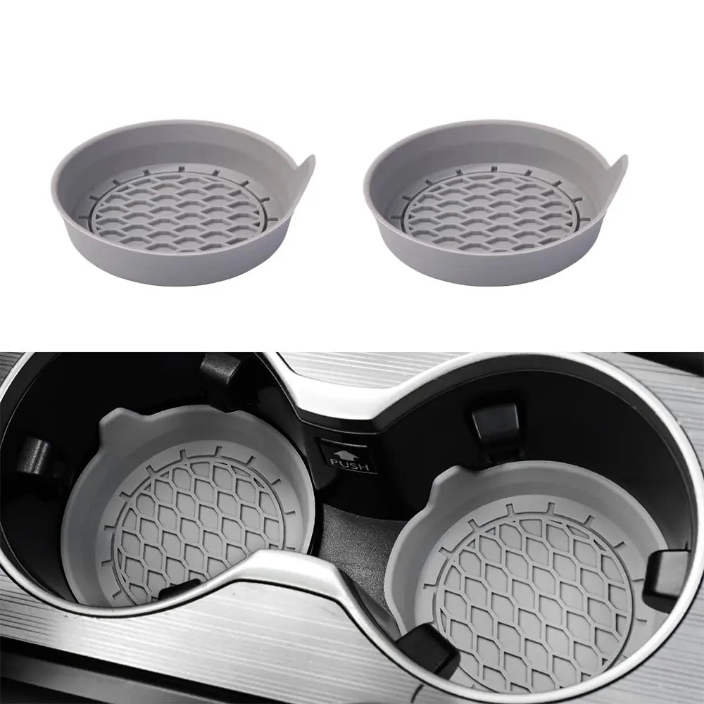 A set of gray silicone cup holder coasters shown separately and inside a black cup holder.