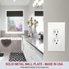 A white solid metal wall plate with two electrical light switch covers mounted on a textured wall.