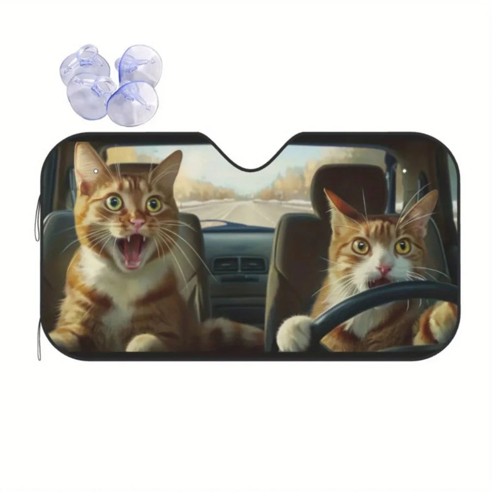 A tabby cat looks out through a car windshield, with purple glass spheres visible outside.