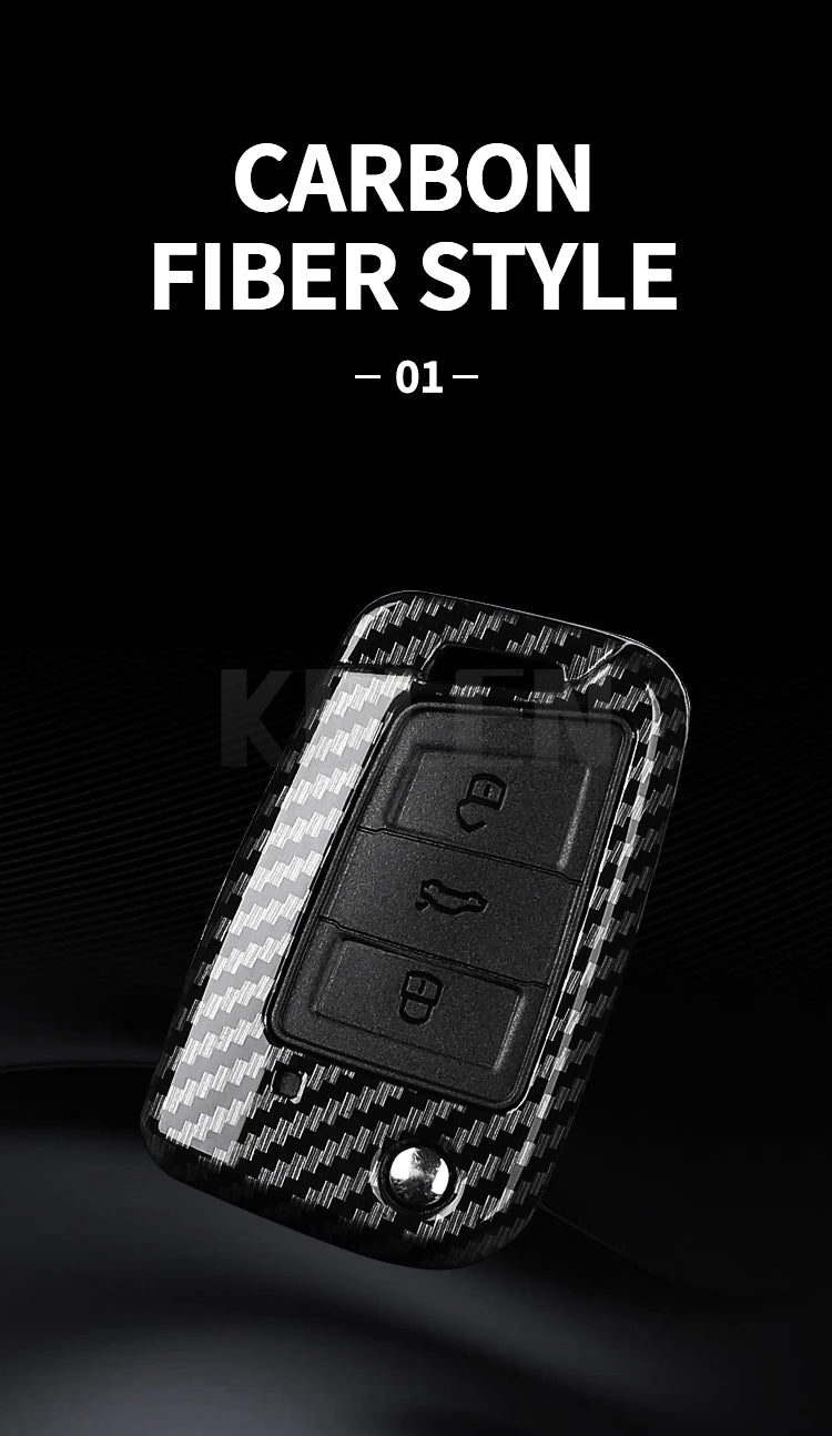 A close-up view of a black carbon fiber style button cover for a car key.