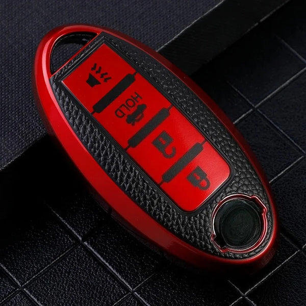 A red car key fob cover with a textured surface and multiple indentations for keys.
