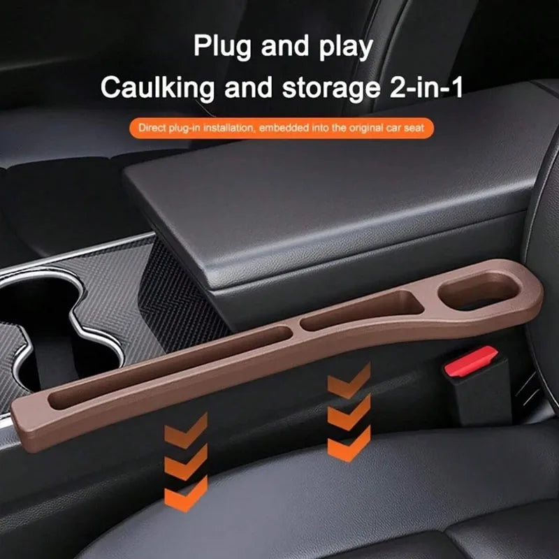 A brown dual car seat gap filler organizer is shown installed in a car seat, designed for caulking and storage.
