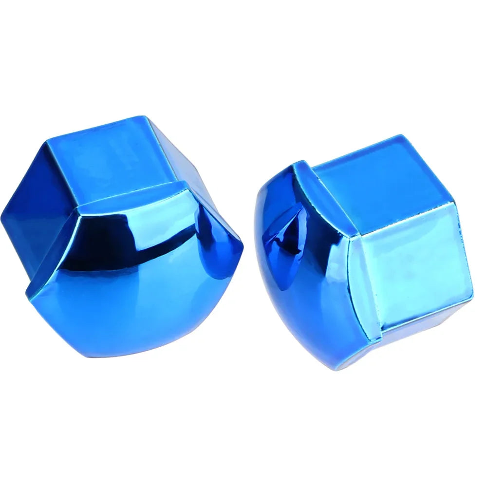 A pair of shiny blue car wheel nut protection covers.