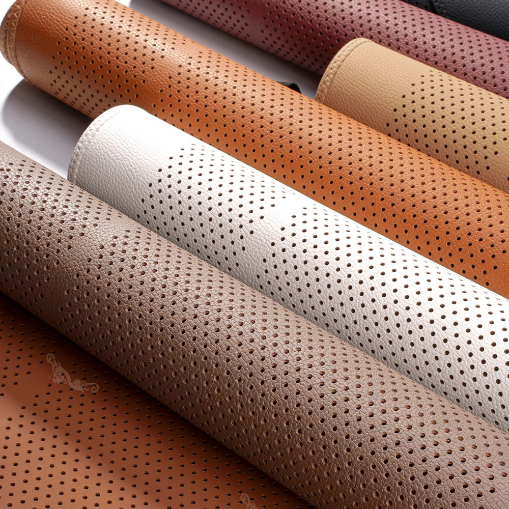 A close-up view of several premium breathable car seat cushions in various leather and fabric colors.