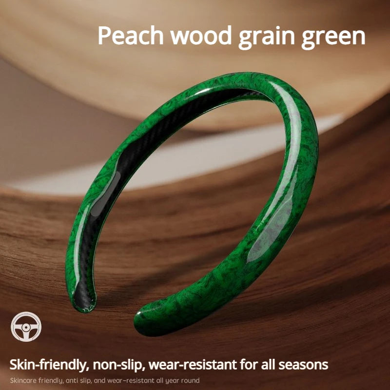 A close-up of a green peach wood grain steering wheel cover shown on a wooden surface.