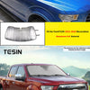 Aluminum foil windshield sunshade for a Ford F150 truck.